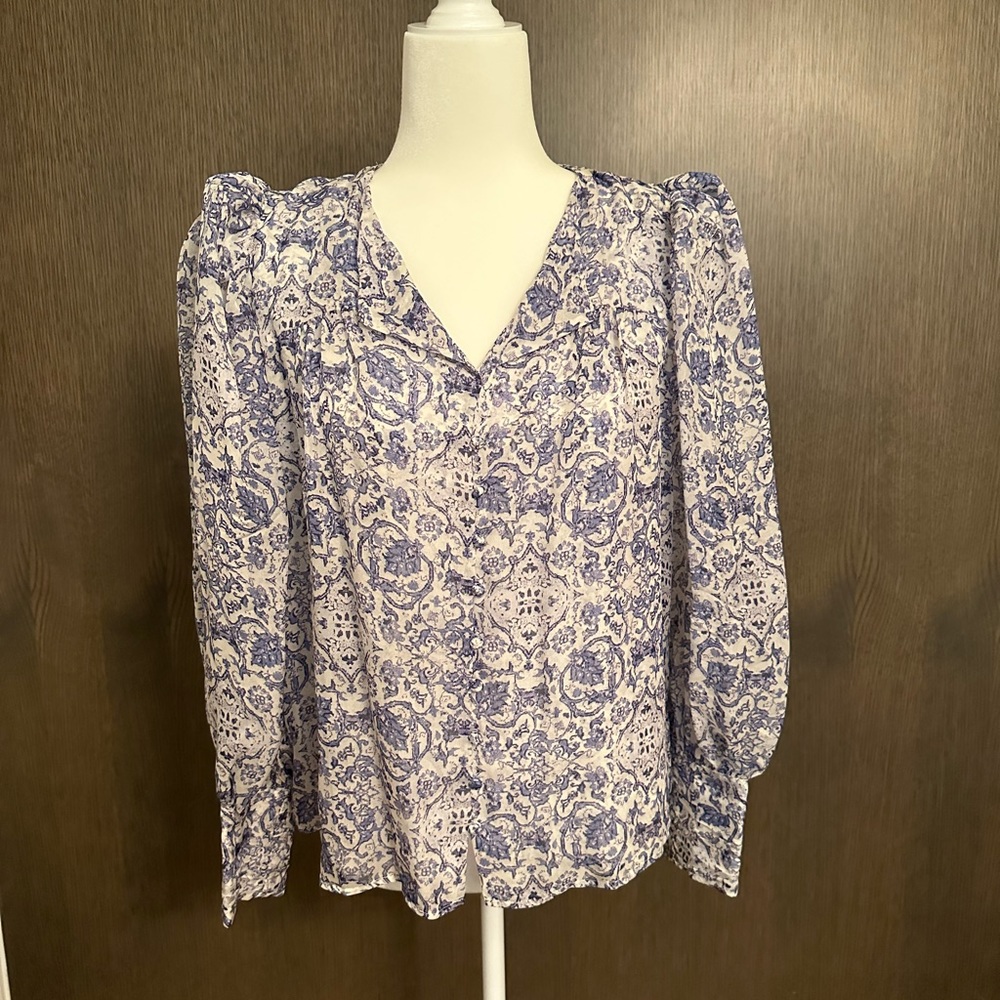 Intermix brand puffed long sleeve blouse with tight cuff at wrist.